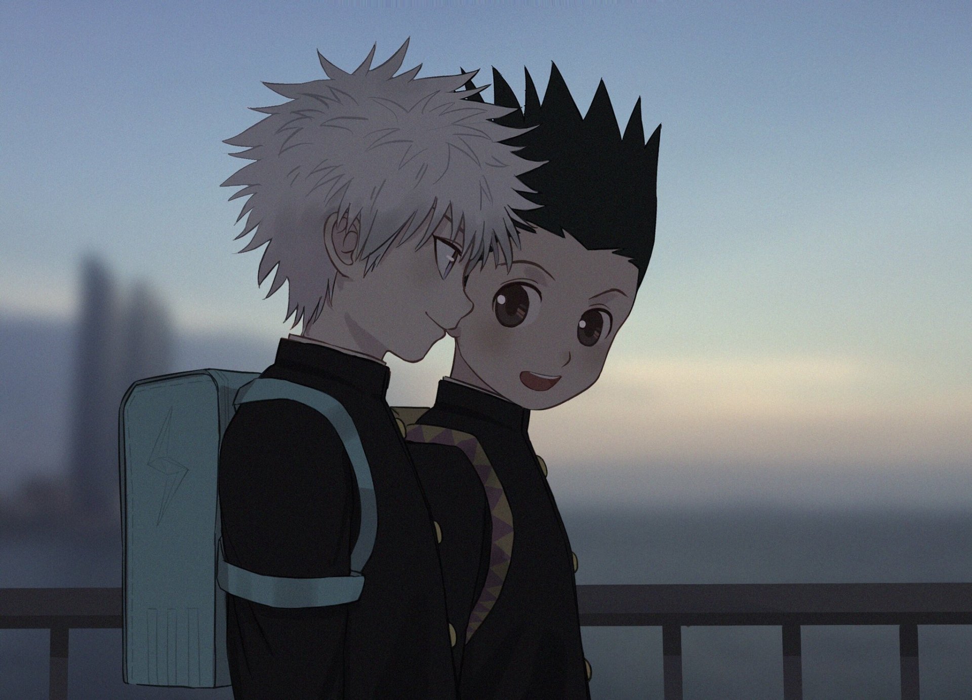 HD desktop wallpaper of Killua Zoldyck and Gon Freecss from the anime Hunter x Hunter, standing together in uniforms against a peaceful sunset background.