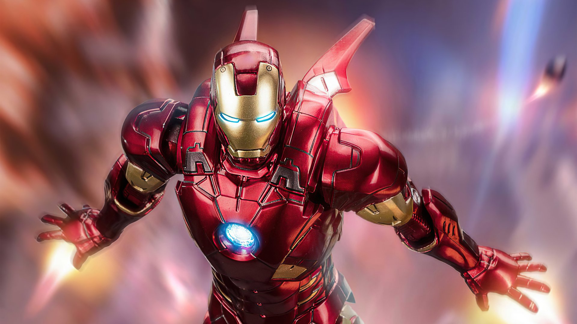 Comic-style Iron Man in red-and-gold armor hurtles forward, arc reactor glowing and thrusters flaring amid motion blur — 4K Ultra HD PC desktop wallpaper and background.