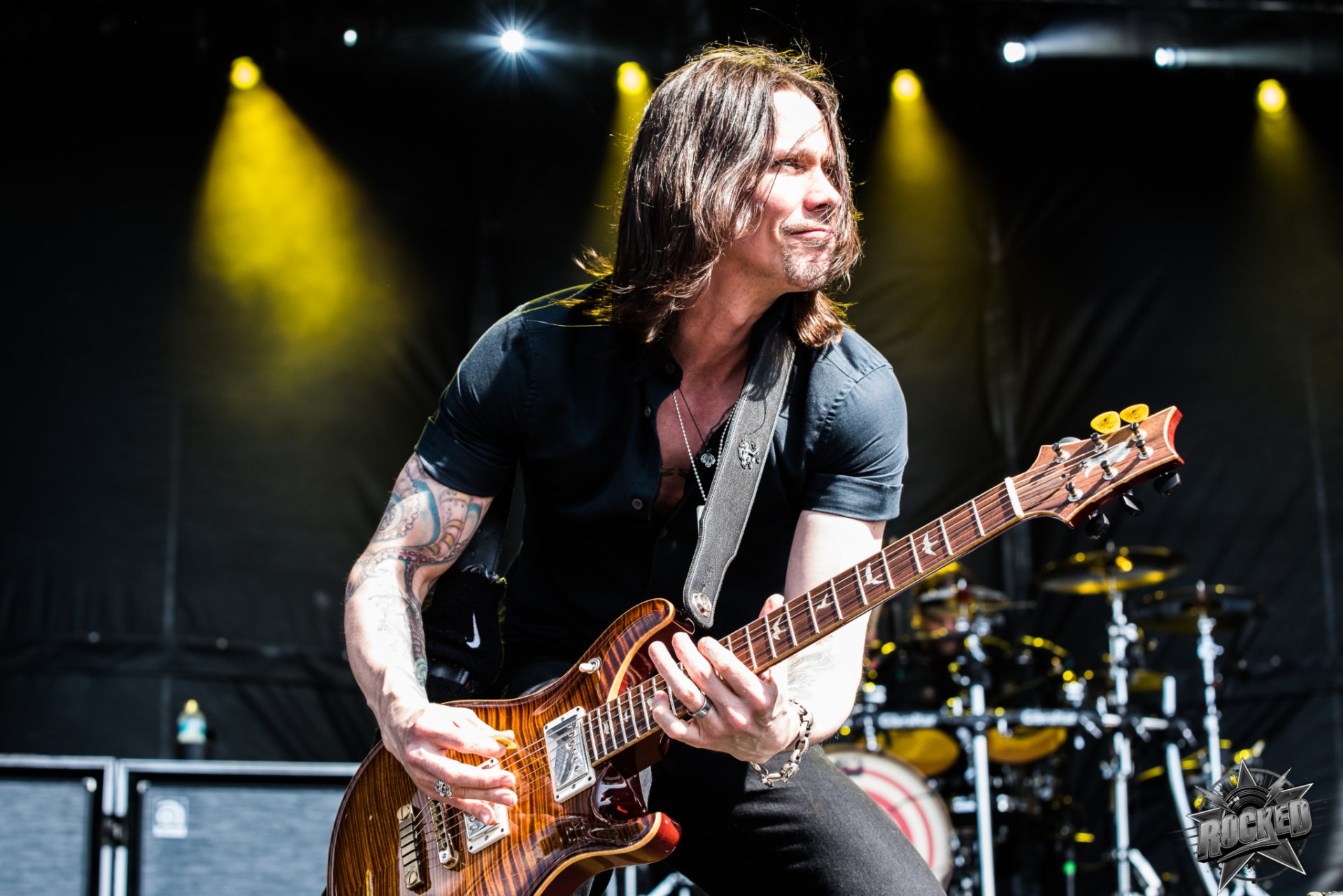 Guitarist performing on stage HD wallpaper for desktop background.