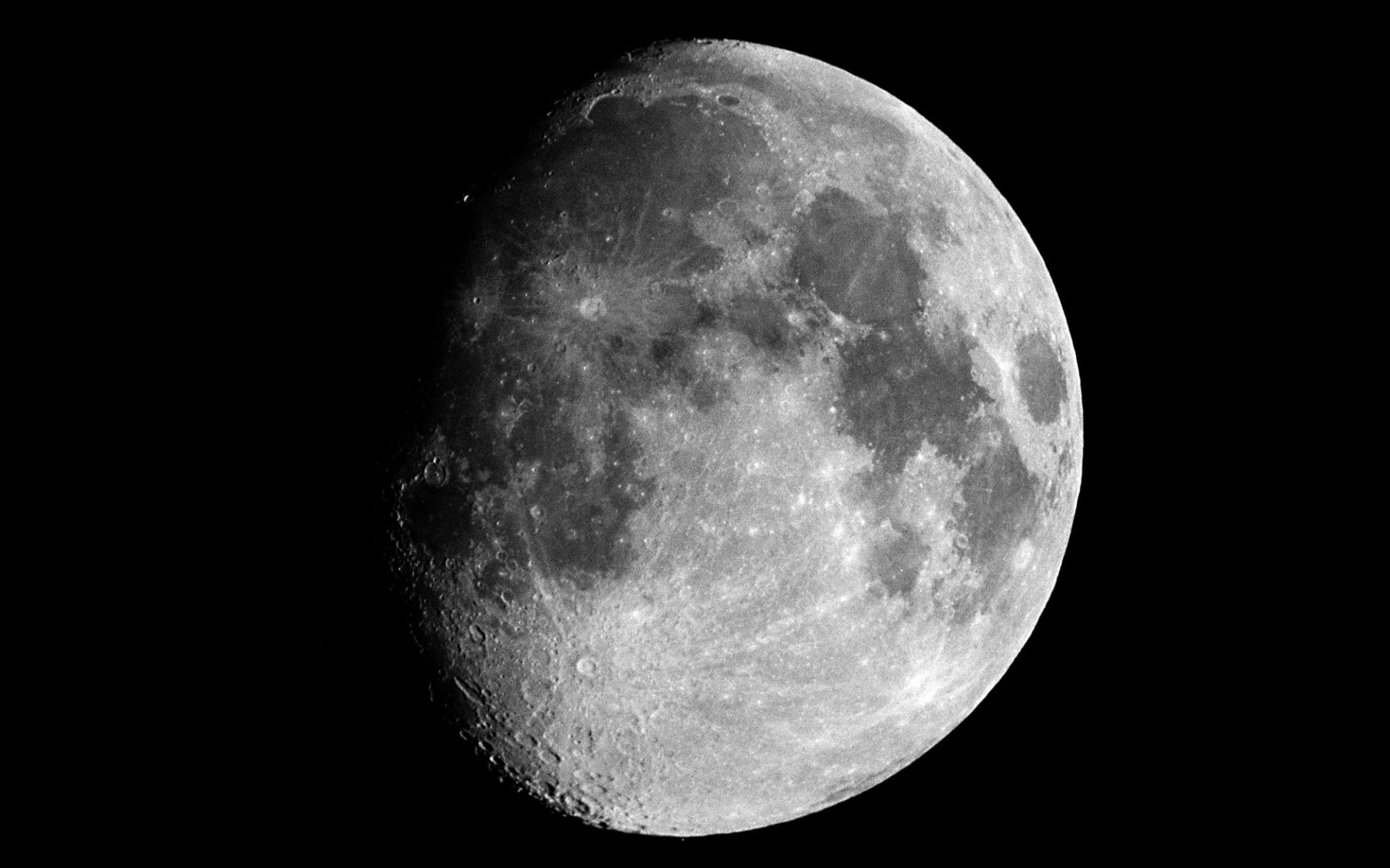 A stunning HD wallpaper showcasing the moon in a crescent phase, set against a deep black backdrop, highlighting its detailed craters and serene beauty in nature.
