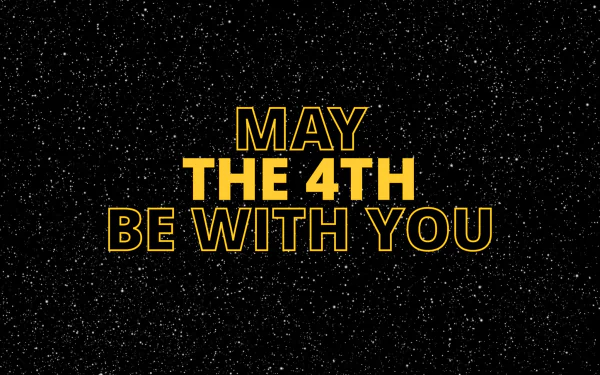 HD desktop wallpaper featuring the phrase May the 4th Be With You in bold yellow letters on a starry space background, celebrating Star Wars Day.