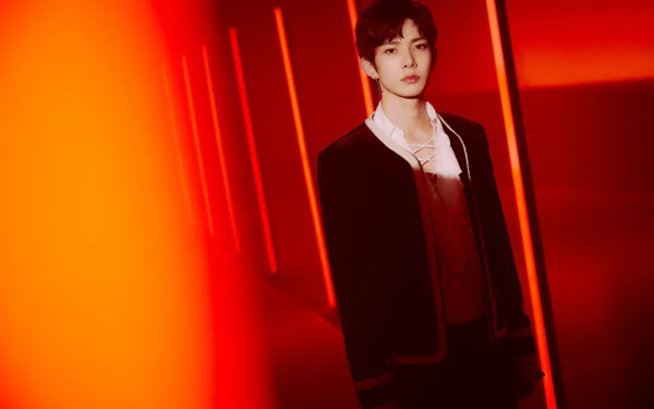 5K Ultra HD music desktop wallpaper: lone figure in a deep red-lit corridor, moody stage atmosphere. Tag: ENHYPEN.