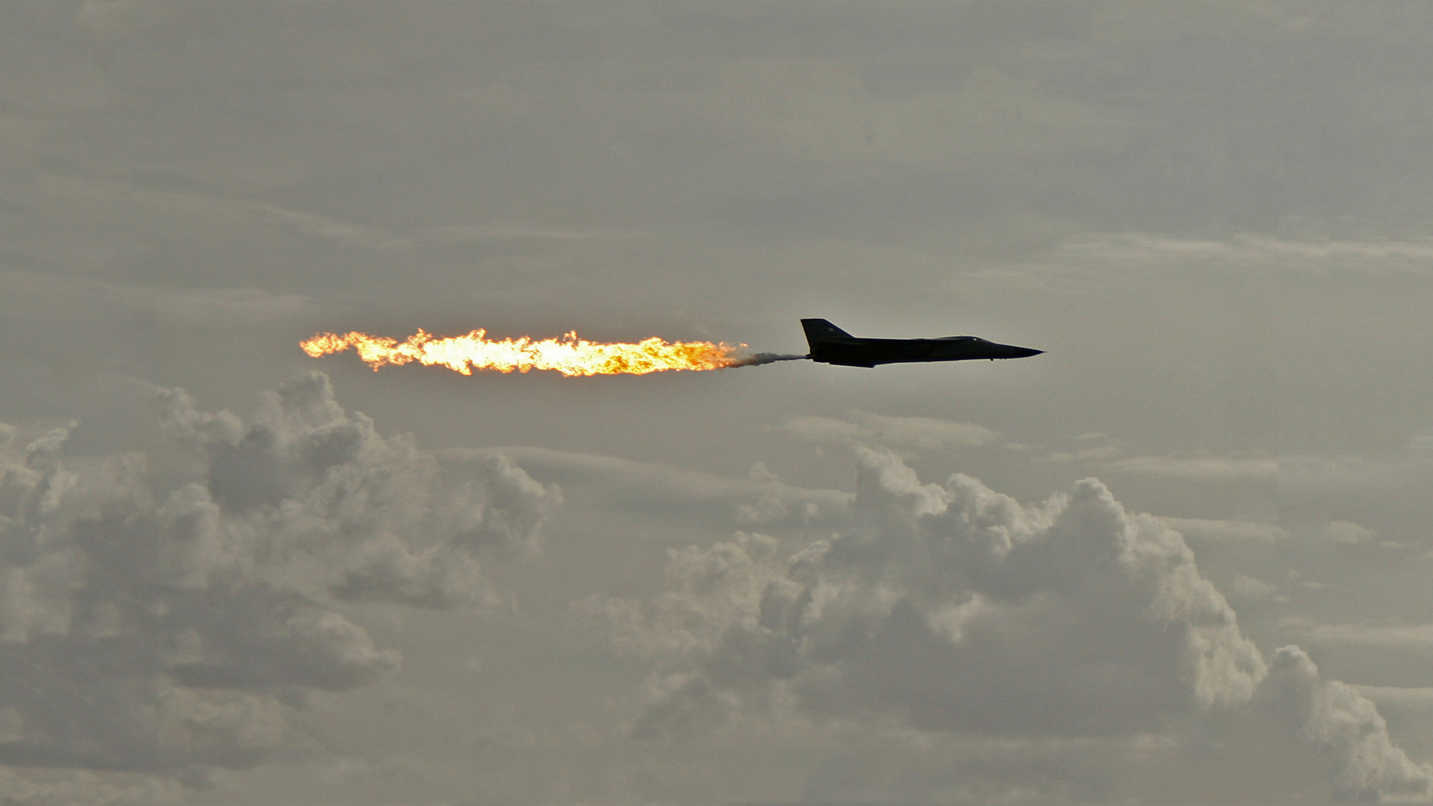 Military aircraft soaring through the skies on a stunning desktop wallpaper.