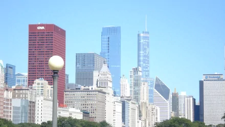 HD desktop wallpaper of Chicago's man-made skyline, modern skyscrapers and historic buildings framed against a clear blue sky.