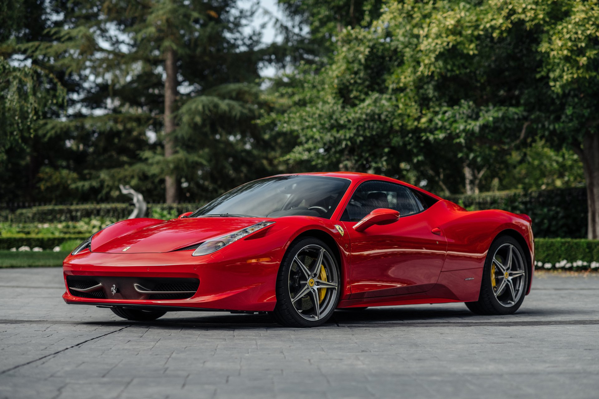 Red Ferrari 458 Italia supercar parked outdoors, showcased as a sharp 4K Ultra HD PC desktop wallpaper and background.