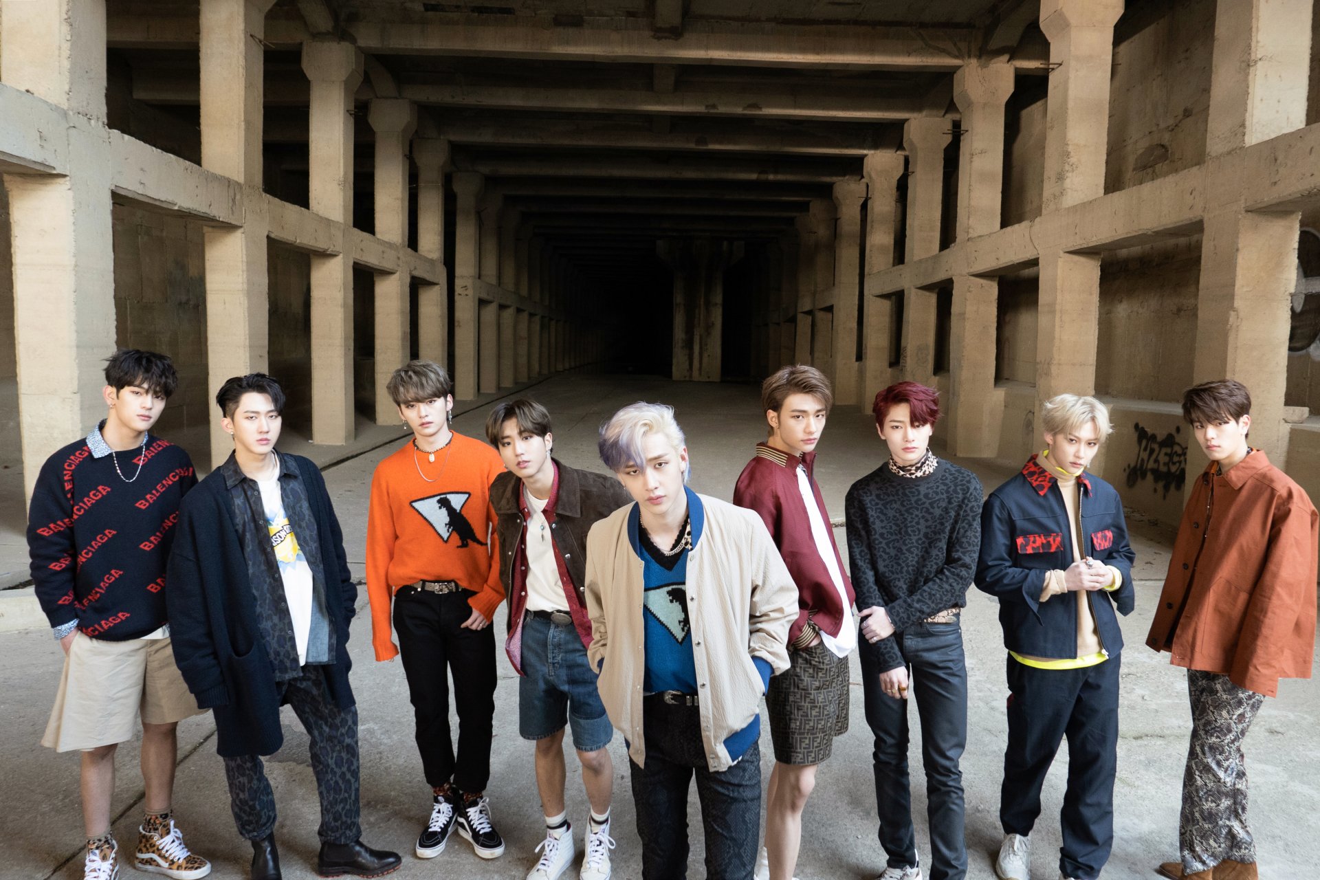 Stray Kids boy band posing in an industrial setting, featured as a 4K Ultra HD K-pop music desktop wallpaper and background.