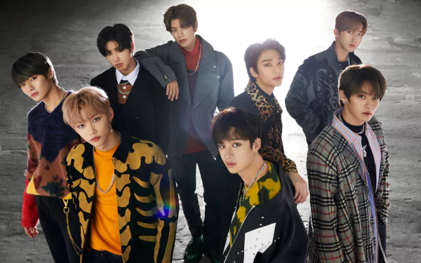 Stray Kids, the K-pop boy band, poses stylishly in an HD PC desktop wallpaper, showcasing their dynamic music and fashion presence.