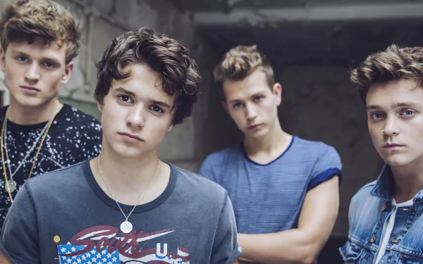 The Vamps band members posing for an HD desktop wallpaper background.