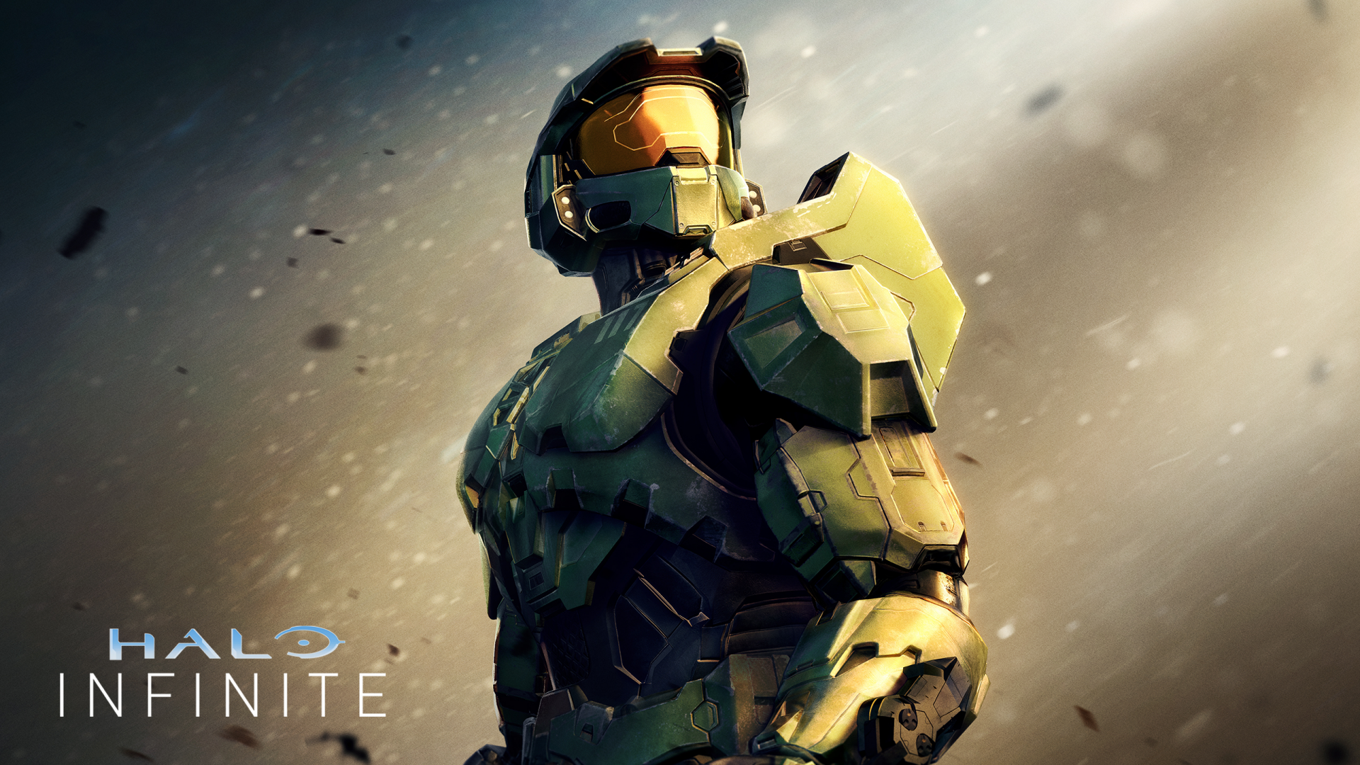 HD desktop wallpaper of a Halo Infinite Spartan soldier looking over the shoulder amidst a dust speckled background.