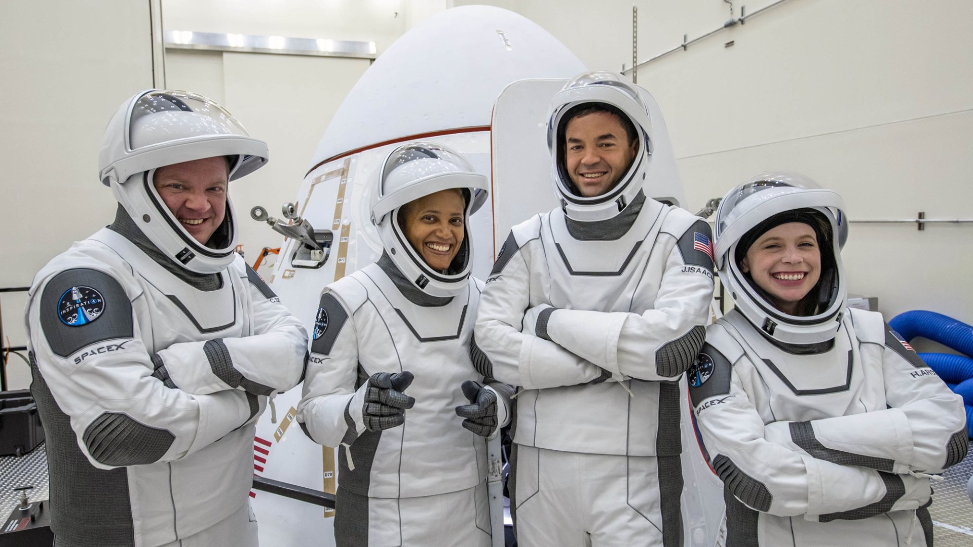 Inspiration4 crew in SpaceX suits smiling before launch, HD desktop wallpaper.