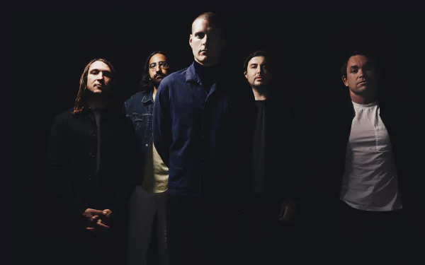 HD desktop wallpaper featuring the band Deafheaven posing dramatically against a dark background.
