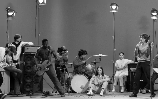 HD desktop wallpaper featuring a black and white photo of a band performing lively, tagged with Turnstile.