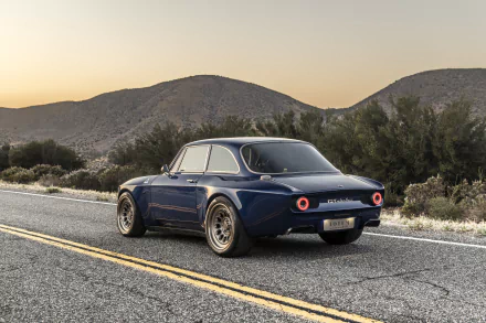 8K Ultra HD PC desktop wallpaper/background of a blue Totem Automobili GT Electric car — an electric vehicle parked on a quiet desert road at sunset.