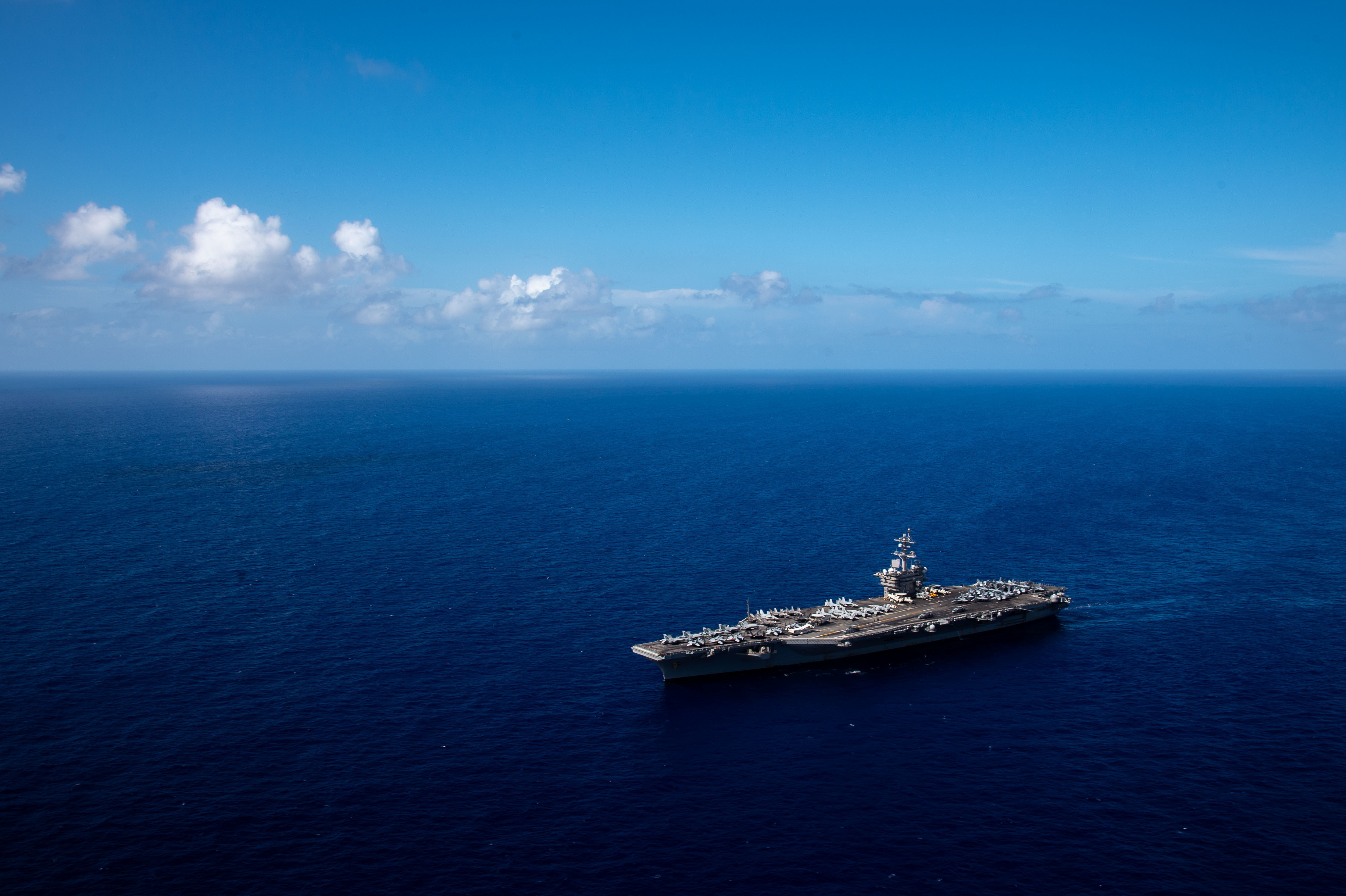 Nimitz-class aircraft carrier USS Carl Vinson transits the Philippine Sea to Guam for a port visit by U.S. Pacific Fleet