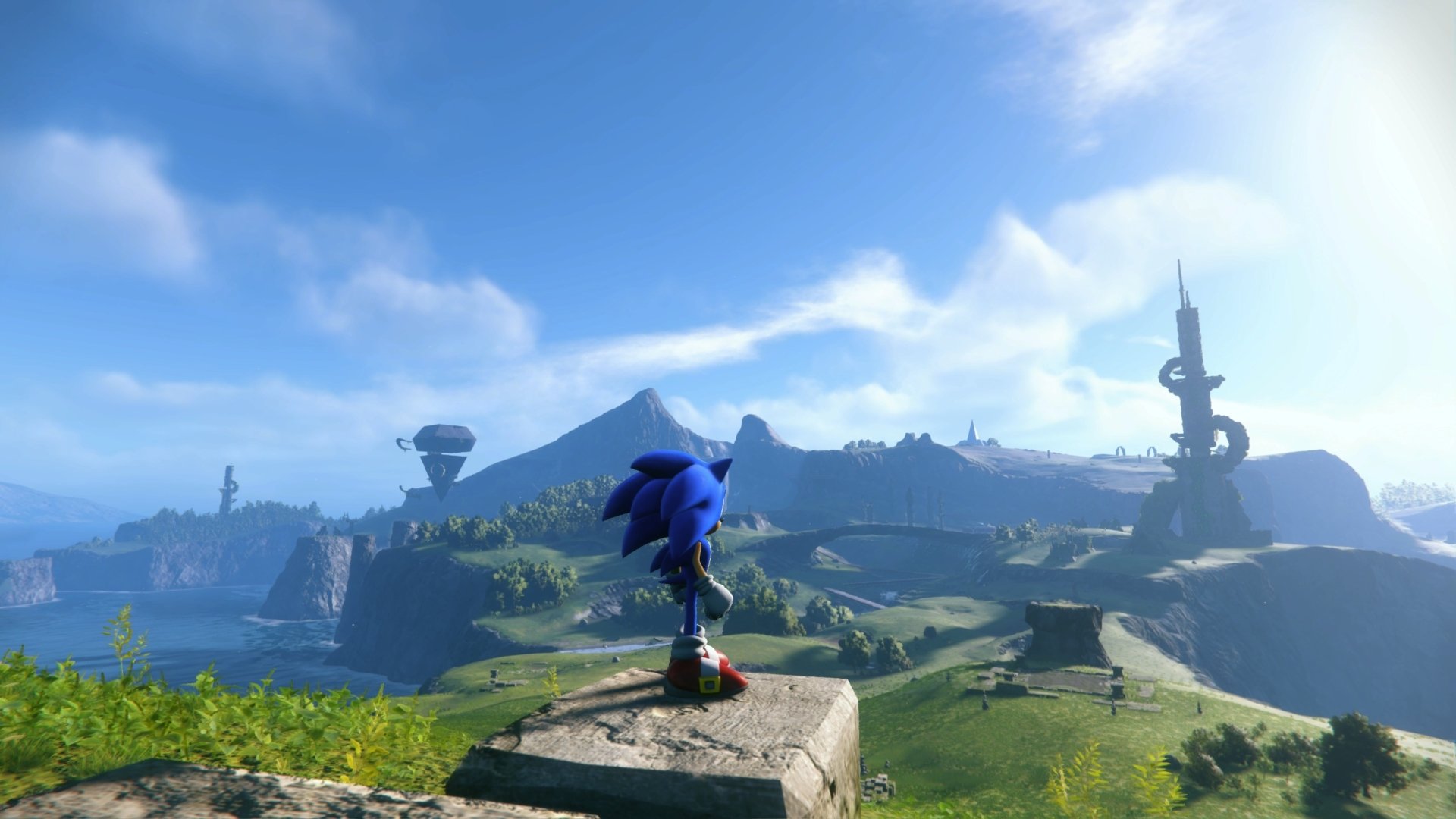Sonic the Hedgehog stands overlooking a vast, detailed landscape from the Sonic Frontiers video game, rendered in stunning 4K Ultra HD for PC desktop wallpaper.