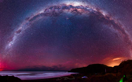 A breathtaking 8K Ultra HD Sci-Fi style night sky showcasing the Milky Way arching over a dark coastal landscape, filled with countless shimmering stars.