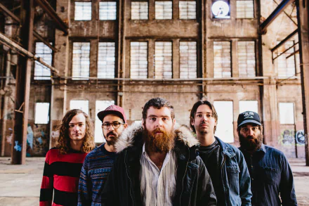 Wallpaper of Manchester Orchestra, an indie rock band, standing together in an industrial setting for their HD desktop background image.
