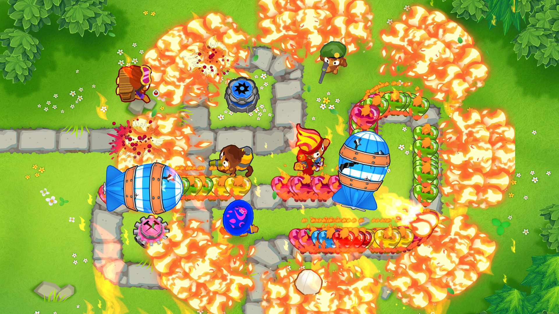 HD desktop wallpaper of Bloons TD 6 game featuring colorful monkey towers defending against balloons on a vibrant battlefield.