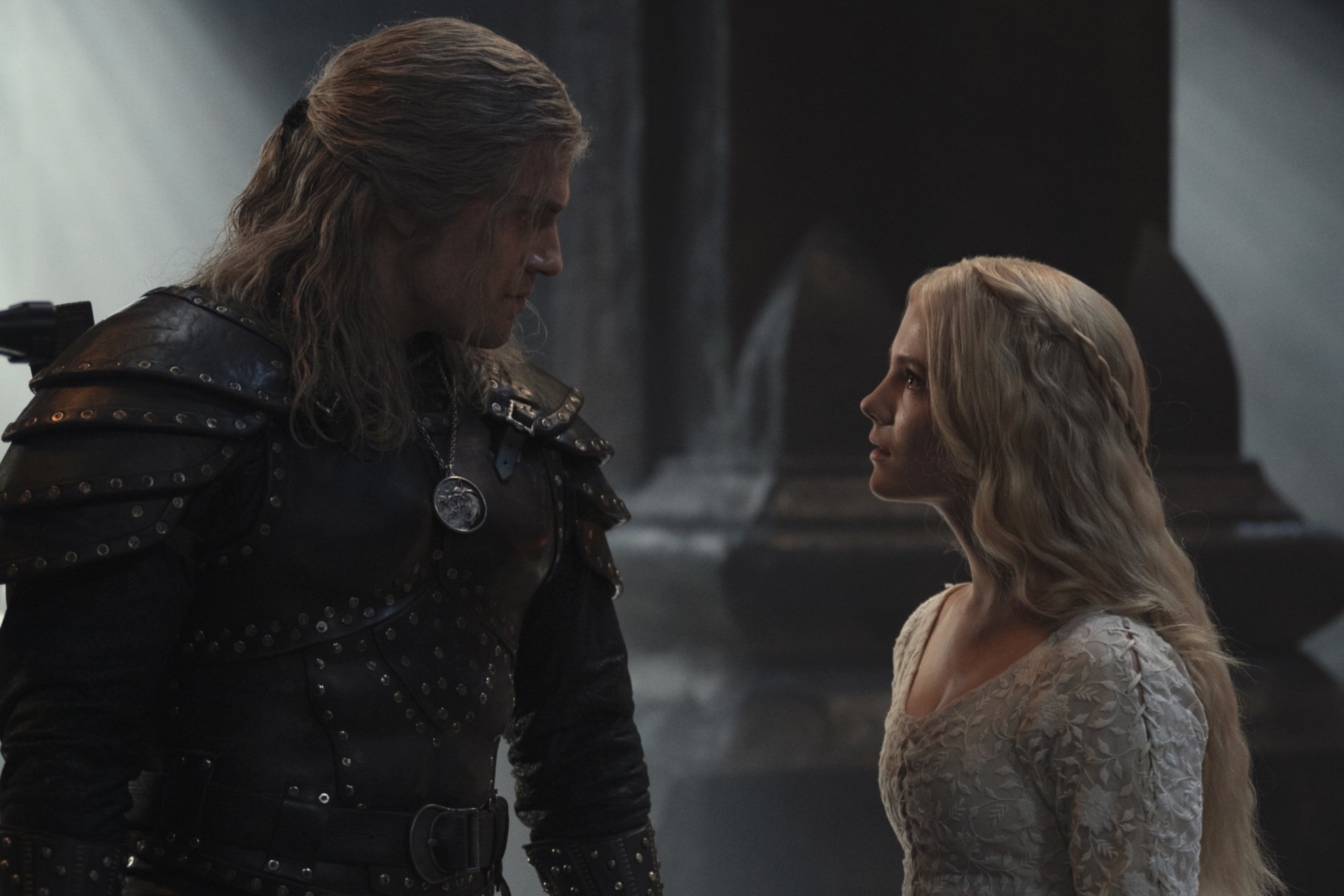 Geralt and Ciri from The Witcher TV show in a dim, dramatic confrontation — 2K Quad HD PC desktop wallpaper.