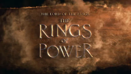 HD PC desktop wallpaper for the TV show The Lord of the Rings: The Rings of Power — metallic title set against a smoky, bronze-hued background.