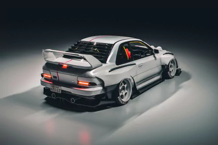 HD desktop wallpaper featuring a sleek sports car with a wide body kit and rear spoiler, showcased in a dimly lit studio setting.