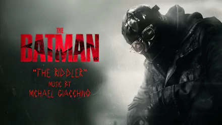 HD PC desktop wallpaper for The Batman movie: the Riddler in a dark coat and gas-mask goggles beside a red The Batman logo and film credit text.