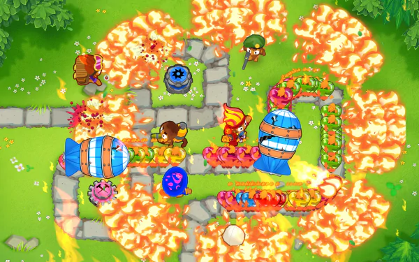 HD desktop wallpaper of Bloons TD 6 game featuring colorful monkey towers defending against balloons on a vibrant battlefield.