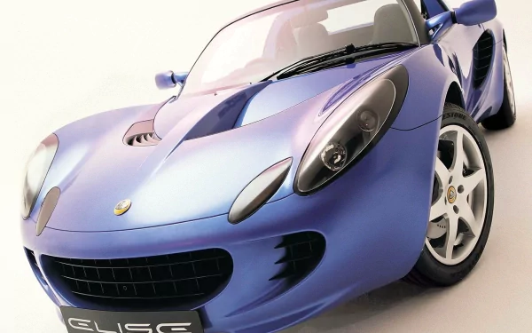 HD PC desktop wallpaper and background showing a metallic blue Lotus Elise sports vehicle angled low with glossy finish, visible headlights and front grille.