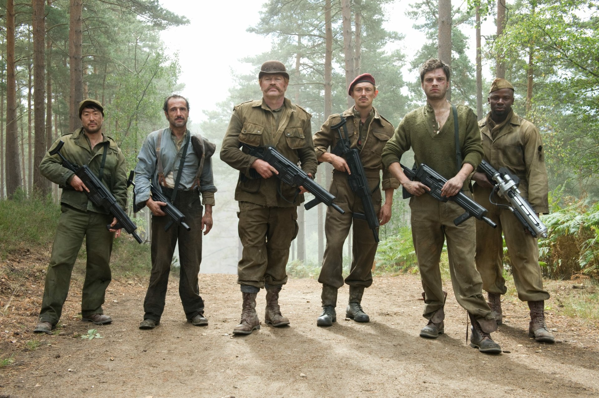 4K Ultra HD PC wallpaper: cinematic still of six WWII soldiers in a forest, including Bucky Barnes from Captain America: The First Avenger, armed and standing together.