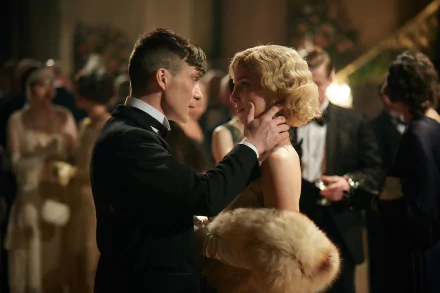 Cillian Murphy as Thomas Shelby from Peaky Blinders shares an intimate moment at a formal party in this HD TV show desktop wallpaper.