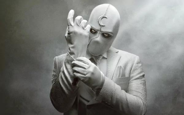 Oscar Isaac as Moon Knight in a monochrome 4K Ultra HD TV show wallpaper, showcasing the character adjusting his glove with a crescent moon emblem on his head.