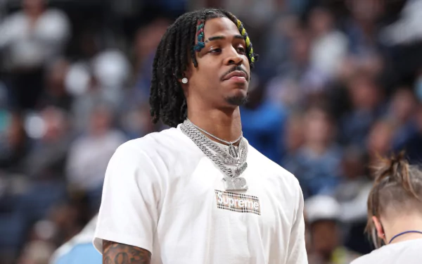 Ja Morant in a high-resolution 4K Ultra HD sports-themed PC desktop wallpaper, showcasing the basketball star in a casual white Supreme shirt with focused expression.