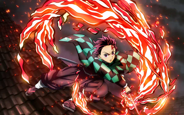Tanjiro Kamado performs Hinokami Kagura, surrounded by fiery flames in this vibrant 4K Ultra HD Demon Slayer: Kimetsu no Yaiba anime wallpaper.