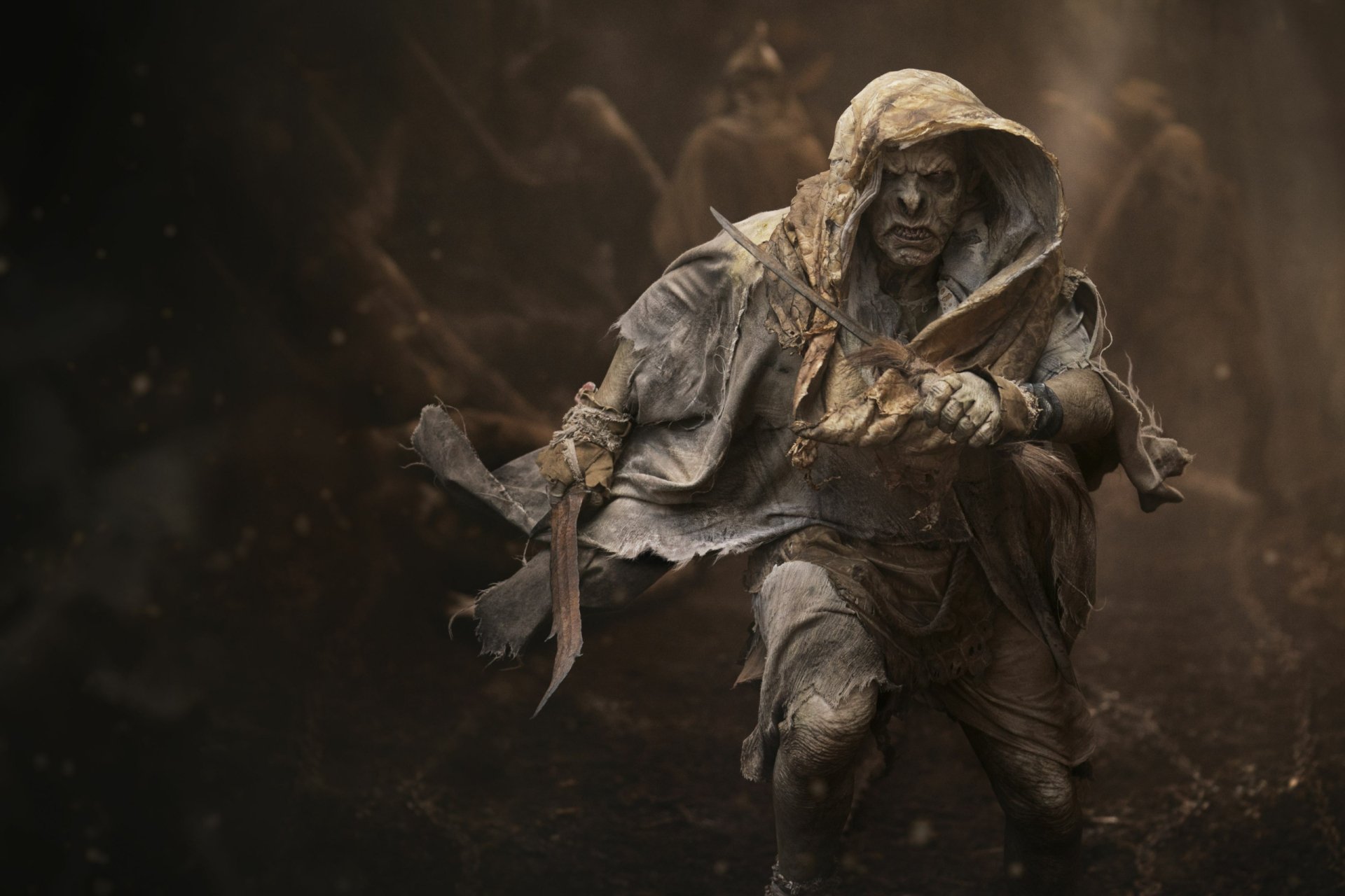 HD desktop wallpaper featuring a dark, hooded figure from the TV show The Lord of the Rings: The Rings of Power.