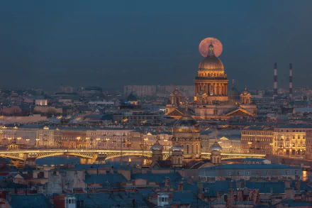 Night view of Saint Isaac's Cathedral in Saint Petersburg, Russia, with the moon rising directly above its dome, illuminating the historic cityscape.