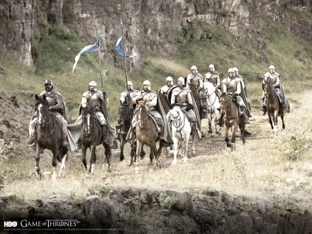 A group of armored knights on horseback, carrying flags, rides through a lush landscape, capturing a scene from the TV show Game of Thrones. High-definition desktop wallpaper.