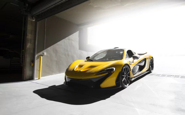 Yellow McLaren P1 vehicle in a sunlit garage — HD PC desktop wallpaper/background showcasing its sleek, aerodynamic lines.