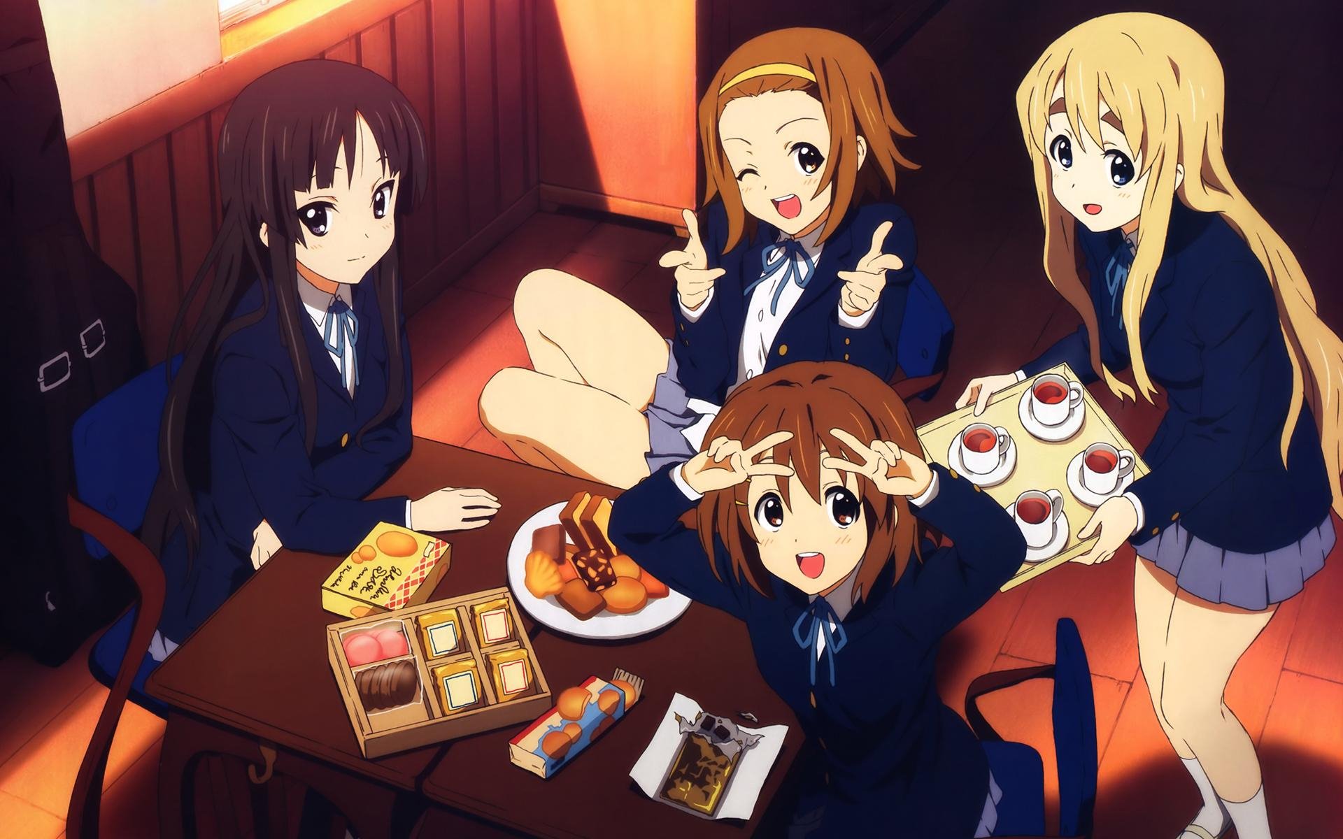 HD PC desktop wallpaper featuring characters from the anime K-ON! enjoying snacks together in a cozy indoor setting.