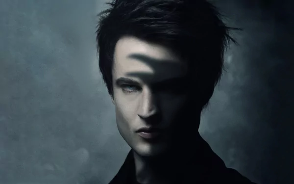 4K Ultra HD PC desktop wallpaper of The Sandman TV show: a pale, brooding figure with dark hair and a hand-shaped shadow across his face against a smoky, moody background.