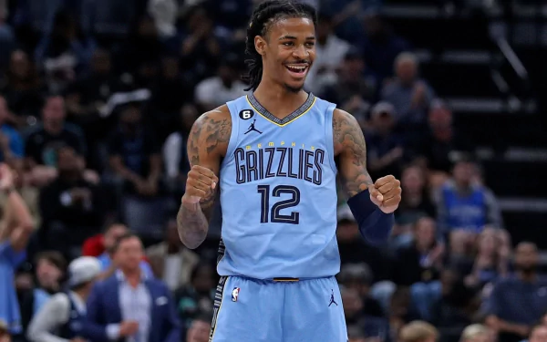 Photo of Ja Morant from the Memphis Grizzlies in an HD desktop wallpaper sporting a focused expression, capturing the essence of professional sports.
