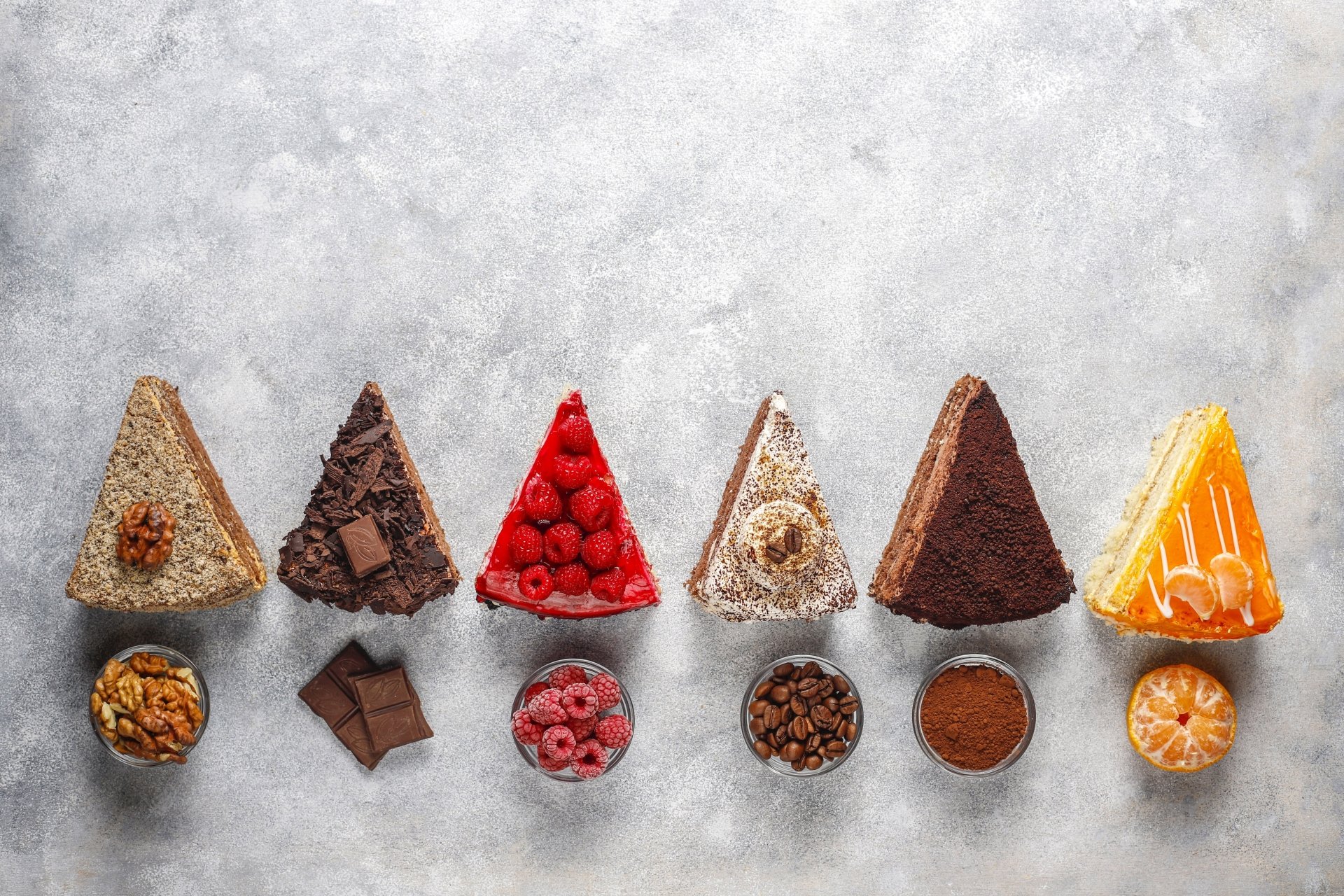 4K Ultra HD desktop wallpaper featuring seven assorted cake slices with matching toppings and ingredients on a light textured background.
