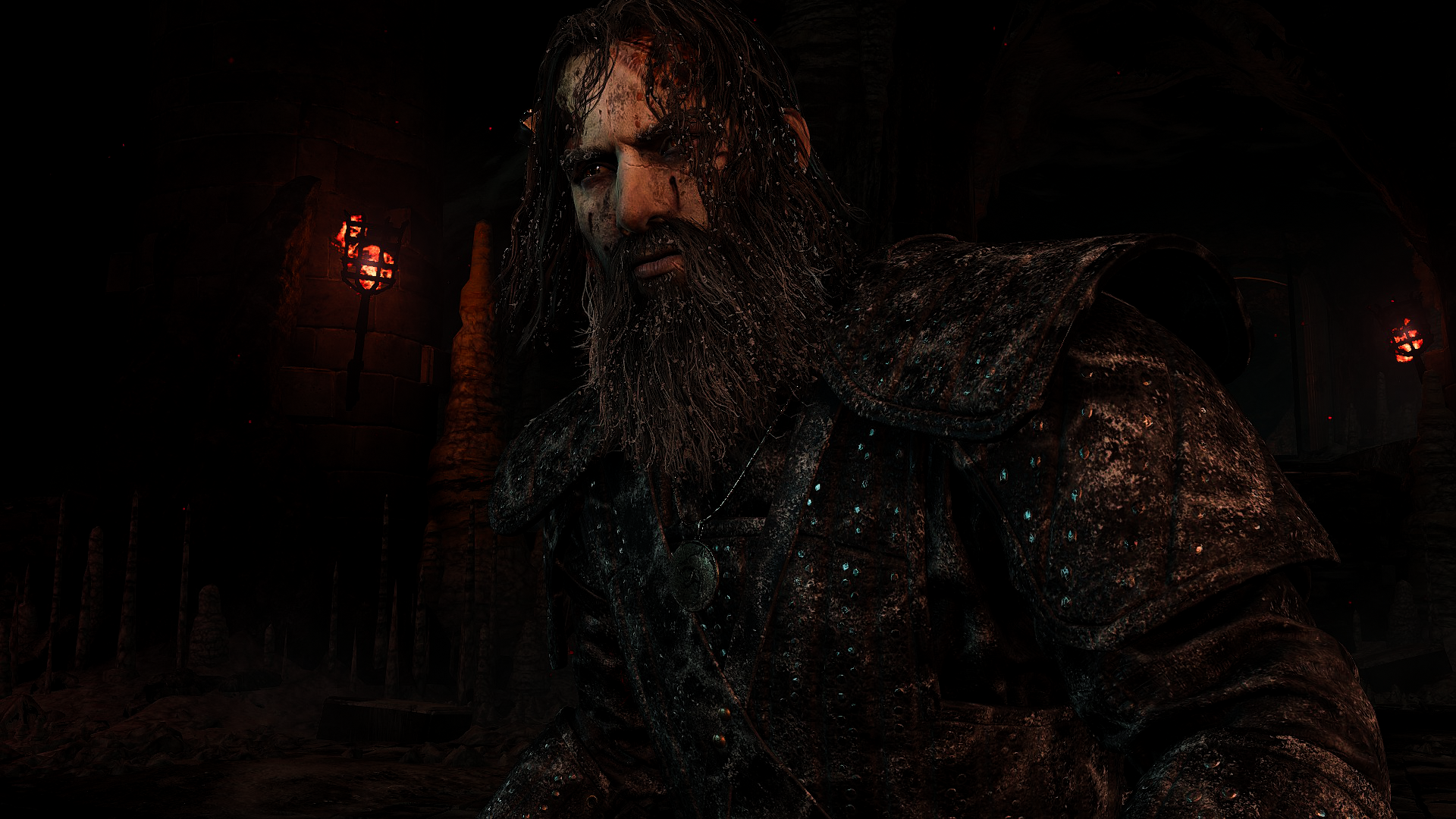 HD PC desktop wallpaper from The Witcher 3: Wild Hunt featuring a rugged, bearded character in dark, detailed armor against a dimly lit background.