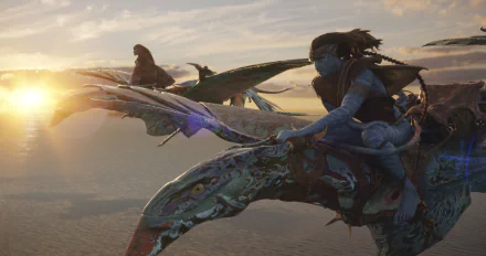 HD desktop wallpaper featuring characters riding flying creatures from Avatar: The Way of Water movie against a backdrop of a stunning sunrise.