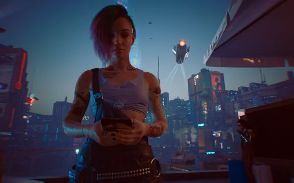 Judy (Cyberpunk 2077) on a neon-lit rooftop at dusk, holding a device as drones and a rain-slick futuristic city glow — HD PC desktop wallpaper background.