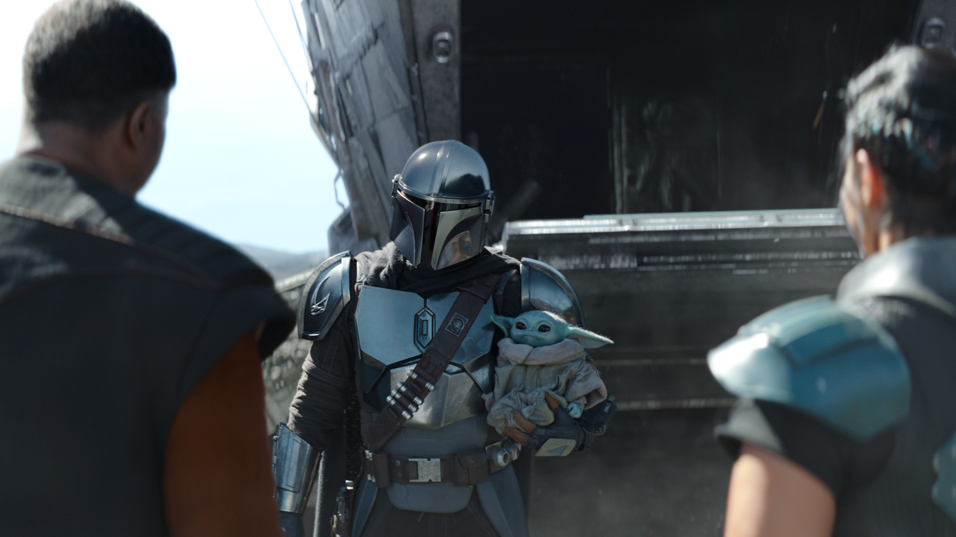 The Mandalorian (TV Show) — beskar-clad Mandalorian holds Grogu at a ship ramp, flanked by allies; cinematic 4K Ultra HD PC desktop wallpaper background.