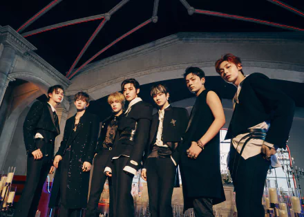 ENHYPEN members pose in stylish black outfits under architectural arches, captured in a dynamic 4K Ultra HD music-themed desktop wallpaper.