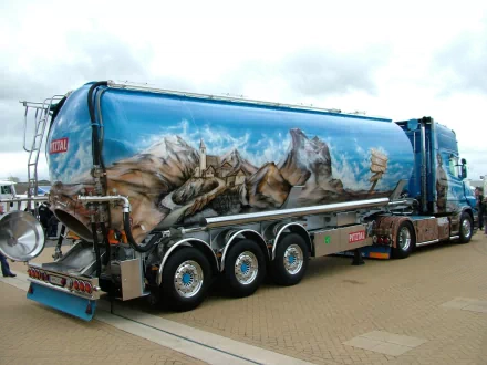 A vibrant, artistic truck featuring a stunning mountain mural, showcased as an HD desktop wallpaper and background, highlighting the beauty of vehicle artistry.