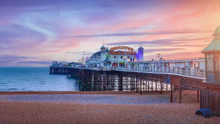  Rides above the tide - Brighton Pier at sunset, England, UK by Peppy Graphics