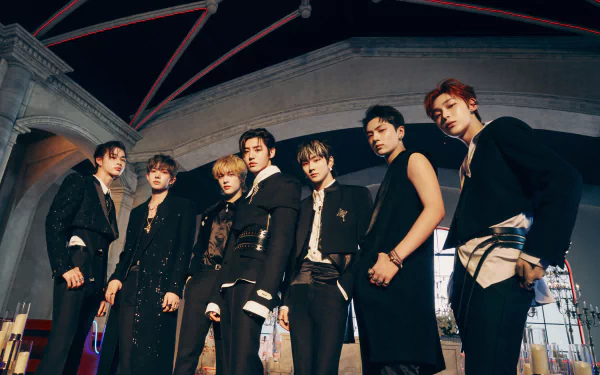 ENHYPEN members pose in stylish black outfits under architectural arches, captured in a dynamic 4K Ultra HD music-themed desktop wallpaper.