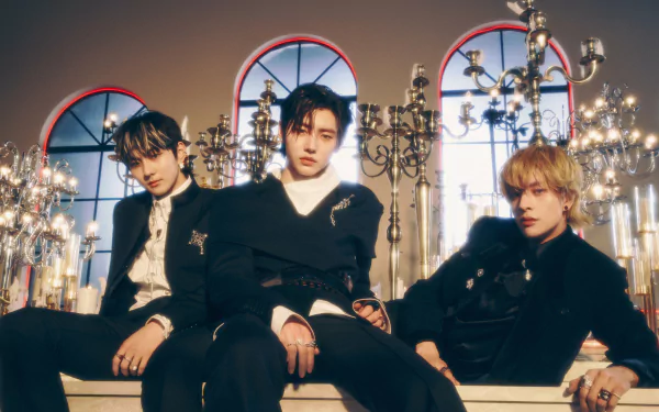 ENHYPEN members pose elegantly in a grand, chandelier-filled room, captured in a 4K Ultra HD music-themed PC desktop wallpaper.